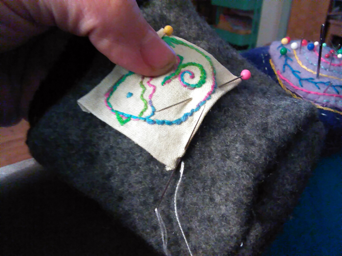 How to Sew and Embroidered Applique onto any Cloth Surface - a tutorial from Muse of the Morning