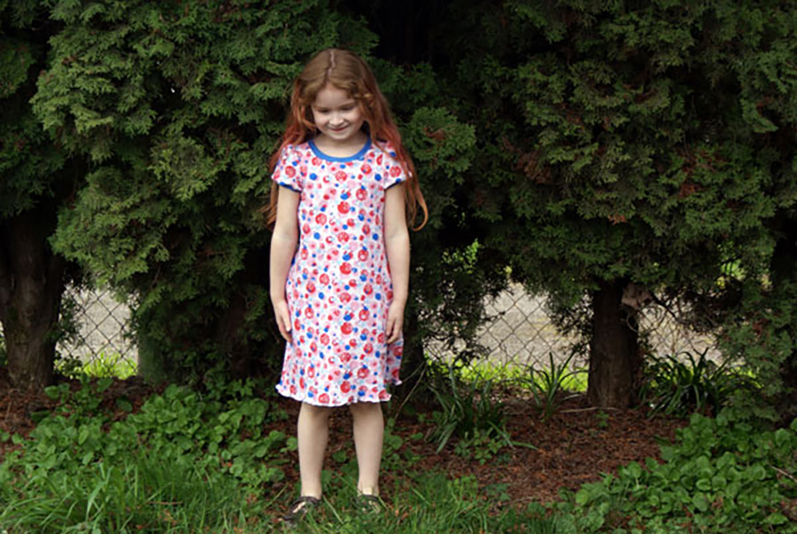 And another tutorial to extend the Practically Perfect Tee Shirt Pattern! This dress will be so much fun for running around in the summer and can really be made any length- make it longer and it will last longer as a dress and eventually as a top for your little girl, or make it knee length and enjoy the freedom running around at the park!



For this pattern extension, you will need 1.5 – 2 yards of interlock for the body, depending on how long you want to make the dress.

First, measure your child from the bottom of her arm pit down to the length you want the dress to go. I like a knee length dress, so my measurement is 21 inches for my tall size 5 girl. If you want to hem the dress, add an inch to your measurement. If you want to just do a lettuce hem (which I love) you don’t need to add anything. We’re going to call this measurement “X”.



Now, lay out the back body piece (Piece A) of the pattern on the fold of your fabric. You’ll want to add 3-4 inches to the width for a knee length dress- add even more inches to the width for a longer dress or for a child with a bigger booty.



Measure straight down from the bottom of the arm hole on the pattern to the length you measured – X. Mark this spot with dressmakers chalk or a pencil (Turquoise line in the picture).



Now swing your measuring tape out 3-4 inches and mark measurement X there (Purple line in the picture).



Now, mark a line connecting your two dots and extending out to the folded edge of the fabric (Red line). Cut along this line for the bottom.



Cut out the top part of the pattern. As you are cutting the side, cut along the pattern piece for 5-6 inches (Green Line), then angle out to meet that last mark you made at the bottom (Pink line).



Repeat these instructions with the front body piece (Piece B).

Finish the dress as instructed in your pattern instructions, cutting out and attaching sleeves, neck binding and any other pieces. You can also turn this dress into a tank dress with this tutorial.

Finish the hem as instructed or do a lettuce edge (my favorite way to finish a girls tee!).

And voila! You’ve made it into a lovely little dress. I was kind of thinking this would be Little Miss’s Easter dress.





You can find the Practically Perfect Tee Shirt Pattern in our etsy shop!!

This post was published on Muse of the Morning.com