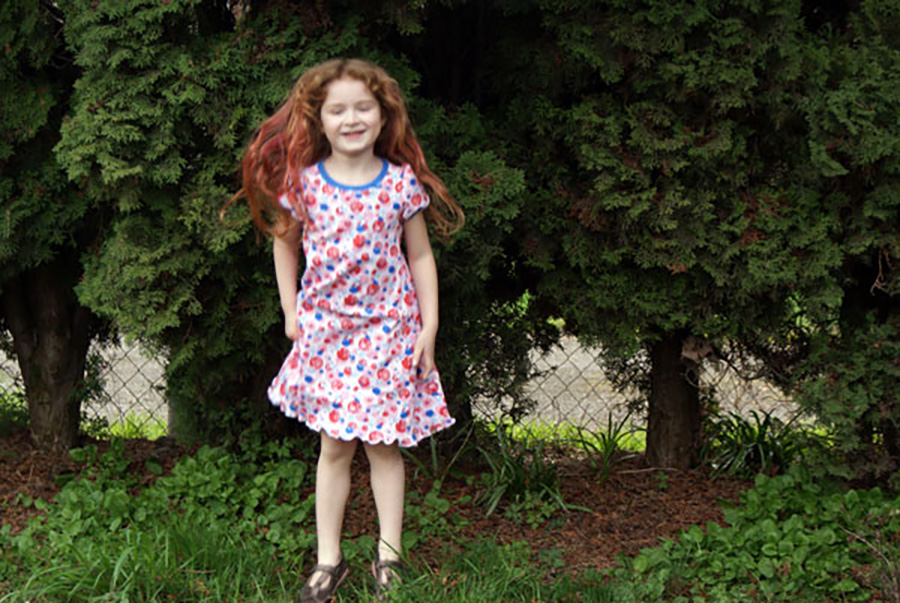 And another tutorial to extend the Practically Perfect Tee Shirt Pattern! This dress will be so much fun for running around in the summer and can really be made any length- make it longer and it will last longer as a dress and eventually as a top for your little girl, or make it knee length and enjoy the freedom running around at the park!



For this pattern extension, you will need 1.5 – 2 yards of interlock for the body, depending on how long you want to make the dress.

First, measure your child from the bottom of her arm pit down to the length you want the dress to go. I like a knee length dress, so my measurement is 21 inches for my tall size 5 girl. If you want to hem the dress, add an inch to your measurement. If you want to just do a lettuce hem (which I love) you don’t need to add anything. We’re going to call this measurement “X”.



Now, lay out the back body piece (Piece A) of the pattern on the fold of your fabric. You’ll want to add 3-4 inches to the width for a knee length dress- add even more inches to the width for a longer dress or for a child with a bigger booty.



Measure straight down from the bottom of the arm hole on the pattern to the length you measured – X. Mark this spot with dressmakers chalk or a pencil (Turquoise line in the picture).



Now swing your measuring tape out 3-4 inches and mark measurement X there (Purple line in the picture).



Now, mark a line connecting your two dots and extending out to the folded edge of the fabric (Red line). Cut along this line for the bottom.



Cut out the top part of the pattern. As you are cutting the side, cut along the pattern piece for 5-6 inches (Green Line), then angle out to meet that last mark you made at the bottom (Pink line).



Repeat these instructions with the front body piece (Piece B).

Finish the dress as instructed in your pattern instructions, cutting out and attaching sleeves, neck binding and any other pieces. You can also turn this dress into a tank dress with this tutorial.

Finish the hem as instructed or do a lettuce edge (my favorite way to finish a girls tee!).

And voila! You’ve made it into a lovely little dress. I was kind of thinking this would be Little Miss’s Easter dress.





You can find the Practically Perfect Tee Shirt Pattern in our etsy shop!!

This post was published on Muse of the Morning.com